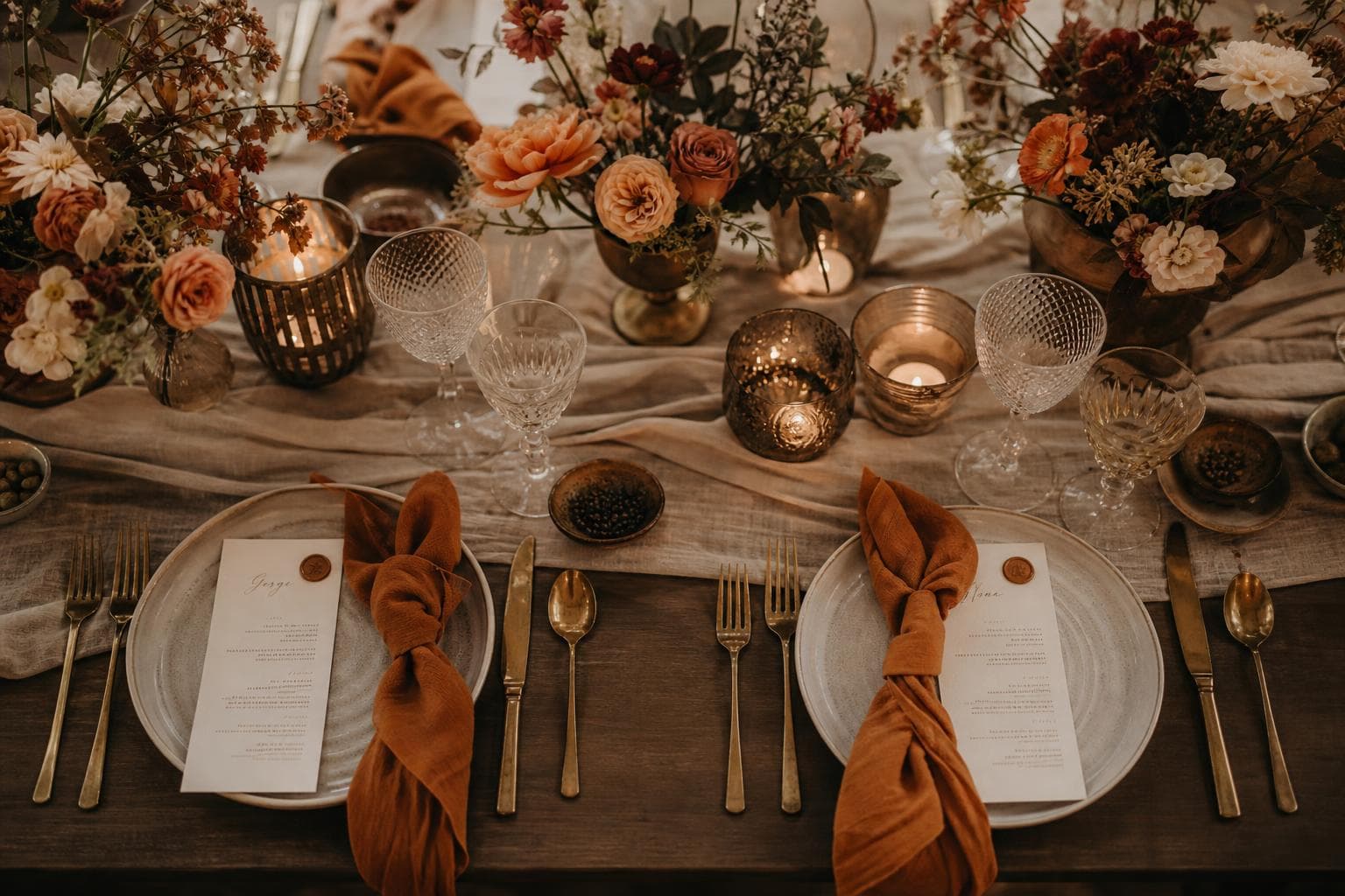 A wedding tablescape concept with coordinated flowers and tableware